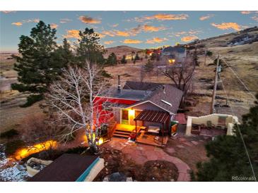 Mountain home with deck, patio, and firepit, offering scenic views at 12041 Twilight St, Longmont, CO 80503