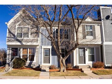 Charming townhouse with a well-maintained front yard and appealing architectural details, including varied siding at 19803 Victorian Way, Parker, CO 80138