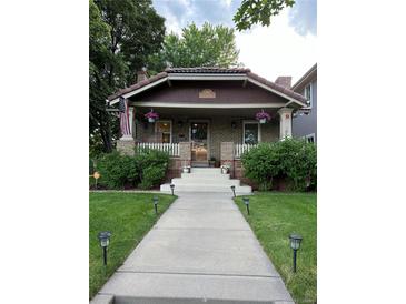 House exterior with walkway and landscaping at 1395 S Josephine St, Denver, CO 80210