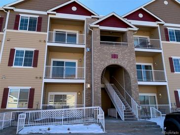 Exterior of a modern apartment building with stairs and accessible entrance at 15700 E Jamison Dr # 5-307, Englewood, CO 80112