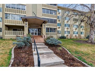 Well-maintained condo building at 350 S Clinton St, featuring manicured landscaping and inviting entrance at 350 S Clinton St # 9C, Denver, CO 80247