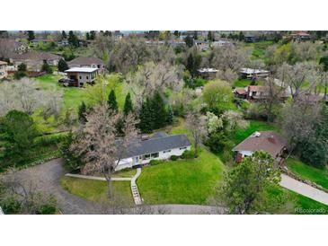 Stunning aerial view of a charming home nestled among lush greenery and mature trees at 1930 Taft Dr, Lakewood, CO 80215