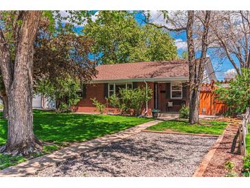 Charming single-story brick home with well-maintained lawn and mature trees at 2274 S Cherry St, Denver, CO 80222