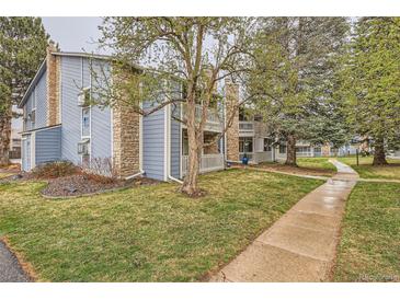 View of the condos, showcasing well-maintained grounds and classic architectural details at 8335 Fairmount Dr # 7-207, Denver, CO 80247