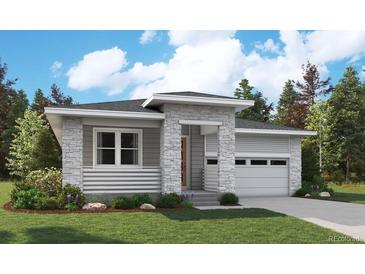 Modern one-story home with stone and siding accents, two-car garage, and landscaped yard at 1111 Joseph Pl, Erie, CO 80026