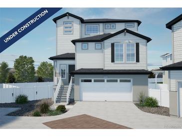 Under construction; charming two-story home showcasing a crisp white color palette and a spacious two-car garage at 22043 E 38Th Pl, Aurora, CO 80019