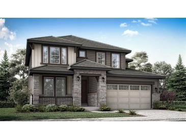 Charming two-story home with stone accents, a covered porch, an attached two car garage, and professional landscaping at 12779 Glasgow Pl, Littleton, CO 80127