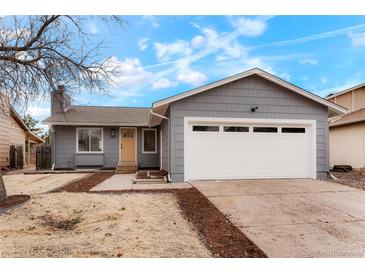 Charming single-story home featuring a two-car garage and a well-maintained front yard at 3643 S Mobile Way, Aurora, CO 80013