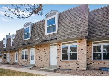Charming brick townhouse with dormer windows and well-maintained landscaping at 1482 S Pierson St # 75, Lakewood, CO 80232