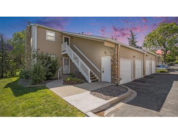 Inviting home featuring a two-story layout, garages, and individual entrances for each unit at 360 S Estes St # C, Lakewood, CO 80228