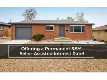 Charming single story brick home with grey trim, well maintained landscaping, and a welcoming front entrance at 740 Lotus Way, Broomfield, CO 80020
