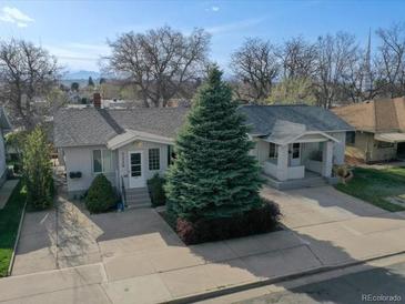 Charming home with a well-maintained front yard and inviting entrance, exuding curb appeal at 3225 S Lincoln St, Englewood, CO 80113