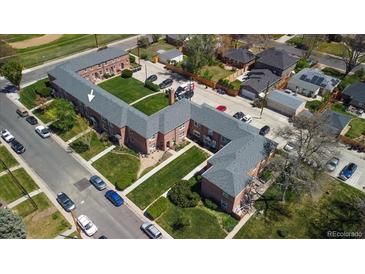 A bird's eye view showcases the U-shaped building with lush greenery and parking at 2872 Jasmine St, Denver, CO 80207