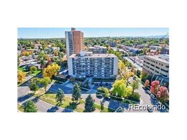 High-rise apartment building with surrounding landscape and city views at 4800 E Hale Pkwy # 709N, Denver, CO 80220