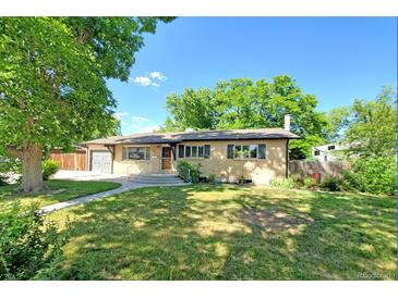 Charming single-story home featuring a well-maintained lawn and a welcoming entrance at 892 S Union Blvd, Lakewood, CO 80228
