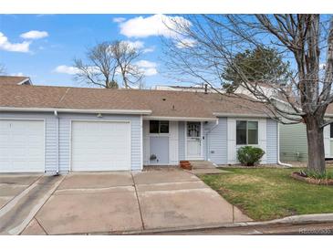 Charming one story home with a well-manicured lawn and attached one car garage at 16120 E Radcliff Pl, Aurora, CO 80015
