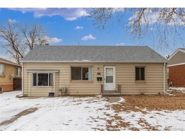 Charming single story home with neutral siding, gray roof, and small front yard at 3280 Ames St, Wheat Ridge, CO 80212