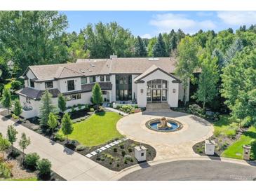 Luxury home with circular driveway and fountain at 4736 S Fillmore Ct, Cherry Hills Village, CO 80113