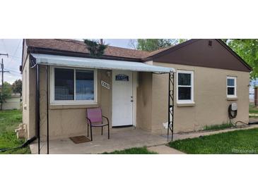 Inviting front porch featuring a charming entrance and decorative awning, perfect for relaxing outdoors at 2880 W 91St Pl, Denver, CO 80260