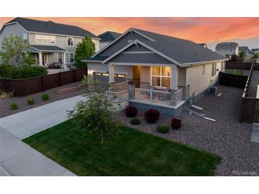 Charming single-Gathering home featuring a welcoming front porch and well-maintained landscaping at 14431 Forest St, Thornton, CO 80602
