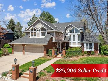 Charming two-story home with landscaped yard, multi-car garage, and classic brick and neutral siding at 3 Winged Foot Way, Littleton, CO 80123