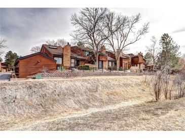 Charming townhomes feature brick accents and mature trees at 2685 S Dayton Way # 141, Denver, CO 80231