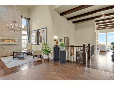 Grand entryway with high ceilings and open staircase at 10510 Ladera Dr, Lone Tree, CO 80124