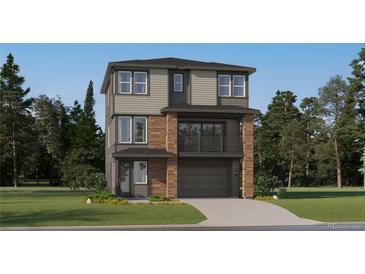 Two-story home featuring stone accents, a two-car garage, a balcony, and professionally landscaped front yard at 7740 S Cherokee Trl, Centennial, CO 80016