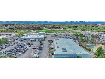 Aerial view shows a large commercial lot with numerous vehicles and a well-maintained collision center building at 364 S Ironton St # 425, Aurora, CO 80012