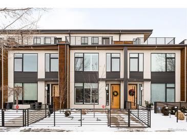 Contemporary three-story townhome with modern exterior finishes at 63 S Jackson St, Denver, CO 80209