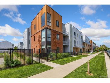 Modern brick building with multiple units and landscaped grounds at 2525 Arapahoe St # Rd108, Denver, CO 80205