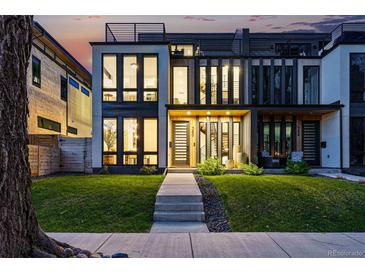 Modern exterior with multi-level decks, lush lawn, and floor-to-ceiling windows offering curb appeal at 380 S Humboldt St, Denver, CO 80209