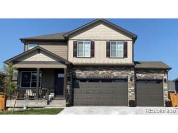 Inviting two-story home with a covered front porch and a three-car garage at 1923 Westport Ave, Berthoud, CO 80513