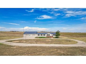 Ranch-style home on spacious lot with circular driveway at 43343 E Arkansas Pl, Bennett, CO 80102