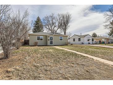 Charming single-story home with neutral siding and a well-maintained front yard, embodying classic suburban appeal at 1248 Moline St, Aurora, CO 80010