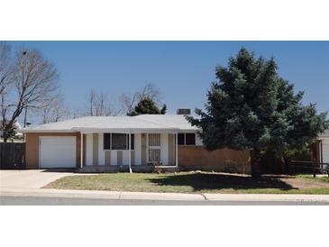 Charming single-story home featuring a well-maintained front yard and an attached garage at 8750 Rutgers St, Westminster, CO 80031