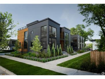 Modern multi-unit building with sleek design and landscaping at 1875 Jay St, Lakewood, CO 80214