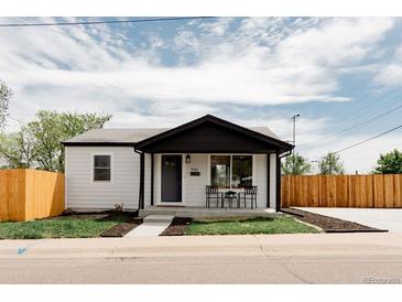 Charming updated home with modern black and white exterior, inviting front porch, and newly landscaped yard at 930 S Lowell Blvd, Denver, CO 80219