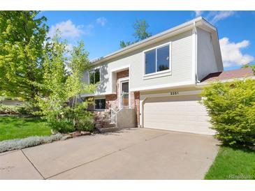 Charming two-story home with a well-maintained yard and attached two-car garage at 2251 Cliffrose Ln, Louisville, CO 80027