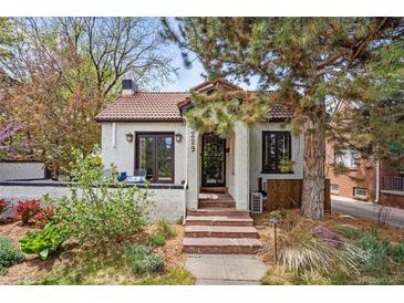 Beautiful home with a red tile roof, landscaped front yard, and charming curb appeal at 229 Albion St, Denver, CO 80220
