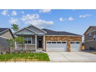 Charming single-story home featuring stone accents and a convenient two-car garage at 1144 Ridgefield Dr, Berthoud, CO 80513