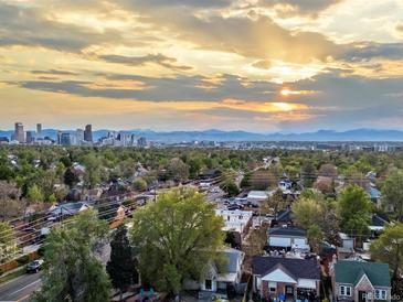 Stunning aerial view of the city skyline at sunset with beautiful trees in the foreground at 3401 N Steele St, Denver, CO 80205