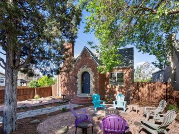 Charming brick home with a cozy outdoor sitting area, perfect for relaxing or entertaining at 3401 N Steele St, Denver, CO 80205