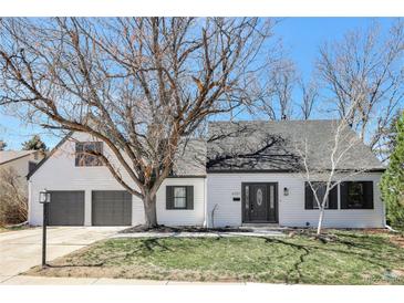 Charming home featuring a well-maintained lawn, mature trees, and a two-car garage at 6707 S Elizabeth St, Centennial, CO 80122