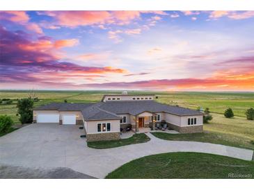 Luxury home on large lot with detached shop, pool, and scenic views at 7905 Schumaker Rd, Bennett, CO 80102