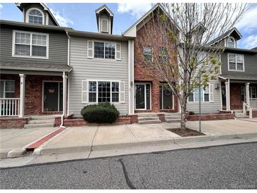 Charming townhouse with brick and siding exterior and well-maintained landscaping at 438 N Parkside Dr # C, Longmont, CO 80501