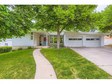 Charming ranch-style home featuring a well-manicured lawn and a two-car garage, ideal for suburban living at 6748 S Gallup St, Littleton, CO 80120