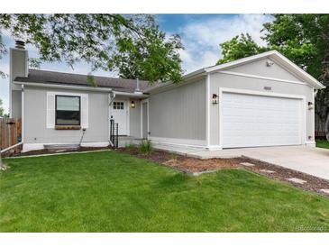 Charming single-Gathering home with a well-maintained lawn and attached garage at 4800 S Tabor St, Morrison, CO 80465