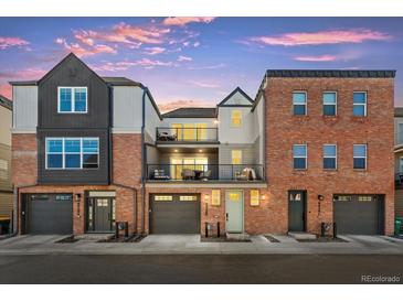 Beautiful townhomes feature brick and modern siding, garages, and private balconies with great curb appeal at 8028 W 52Nd Ln # B, Arvada, CO 80002
