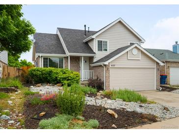 Inviting two-story home with well-kept landscaping, a two-car garage, and beautiful curb appeal at 4127 S Lewiston Cir, Aurora, CO 80013